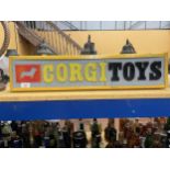 AN ILLUMINATED CORGI TOYS SIGN