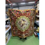 A VINTAGE WOOL WALL HANGING WITH A FLORAL PATTERN