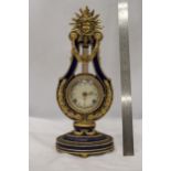 A VICTORIA AND ALBERT MARIE ANTOINETTE STYLE SUN KING GILT METAL MOUNTED PORCELAIN MANTLE CLOCK WITH