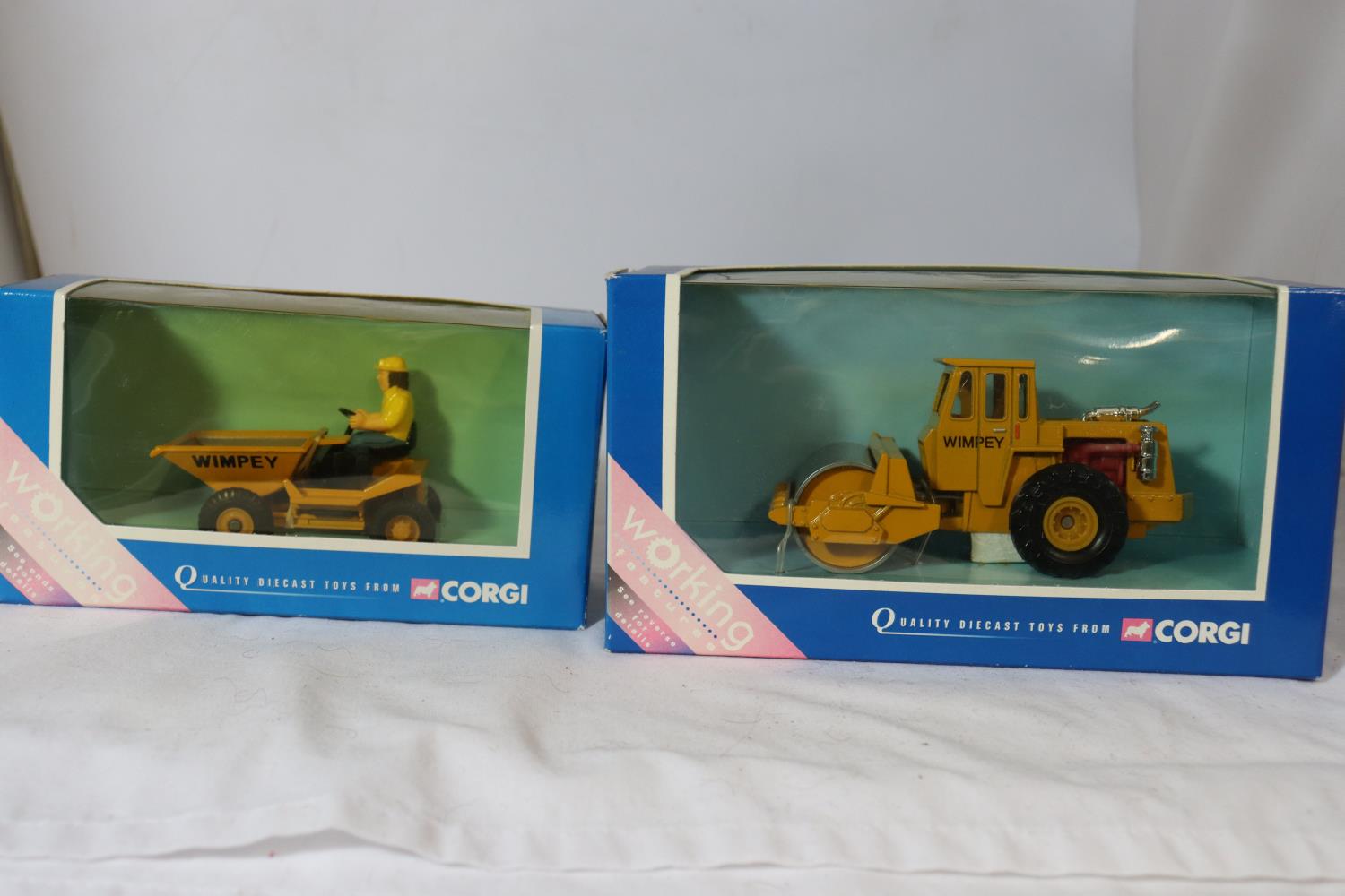 TWO DIECAST CORGI MODELS 64801 DUMPER TRUCK - WIMPEY TIPPING DUMPER AND TY 86001 ROAD ROLLER -