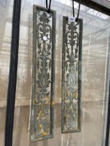 A PAIR OF DECORATIVE BRASS PANELS