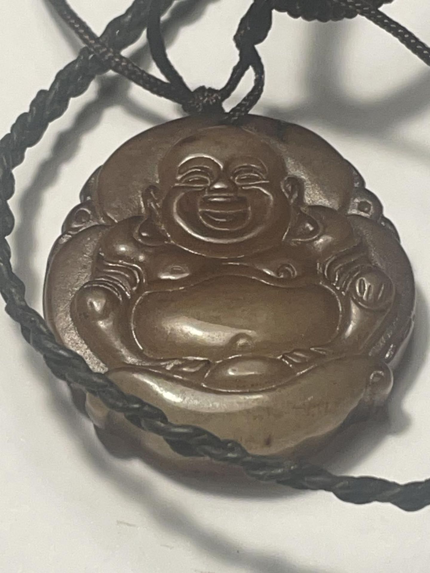 TWO NECKLACES TO INCLUDE A CARVED BUDDHA PENDANT AND A TALISMAN GOOD LUCK AMULET BOTH ON A LEATHER - Image 2 of 4