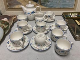 A ROYAL DOULTON WINDERMERE TEASET TO INC;LUDE A TEAPOT, CREAM JUG, SUGAR BOWL, CUPS AND SAUCERS
