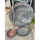 A LARGE COPPER WALL CHARGER AND TWO SMALL COPPER DISHES