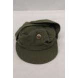 A 1950'S EAST GERMAN MILITARY CAP AND BADGE