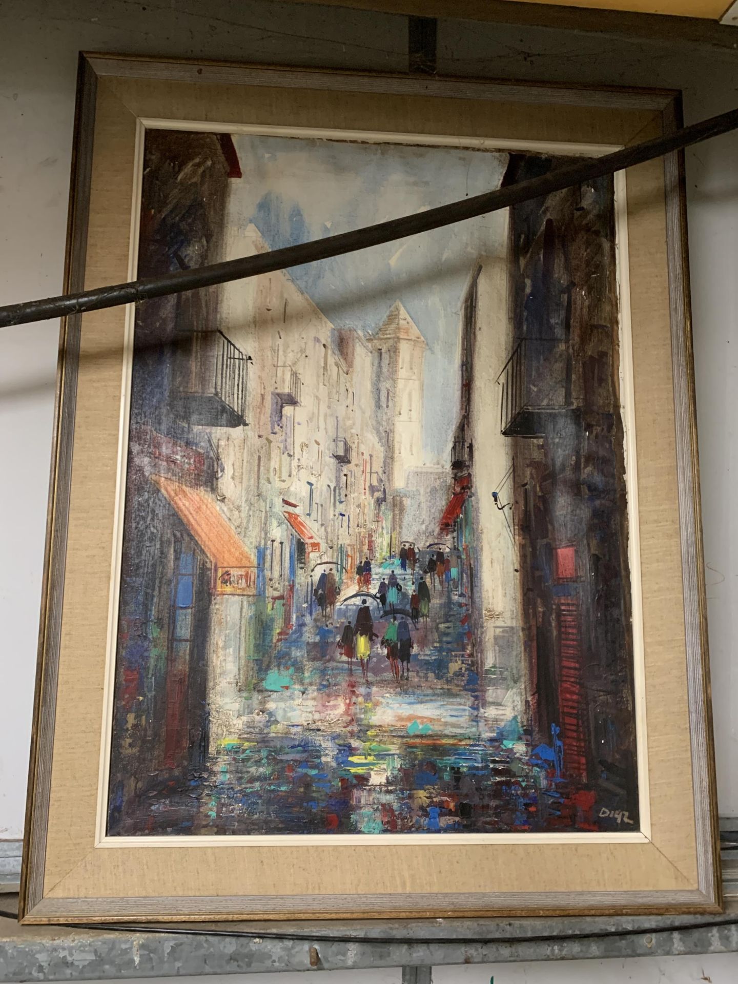 A LARGE OIL ON CANVAS OF A STREET SCENE, SIGNED