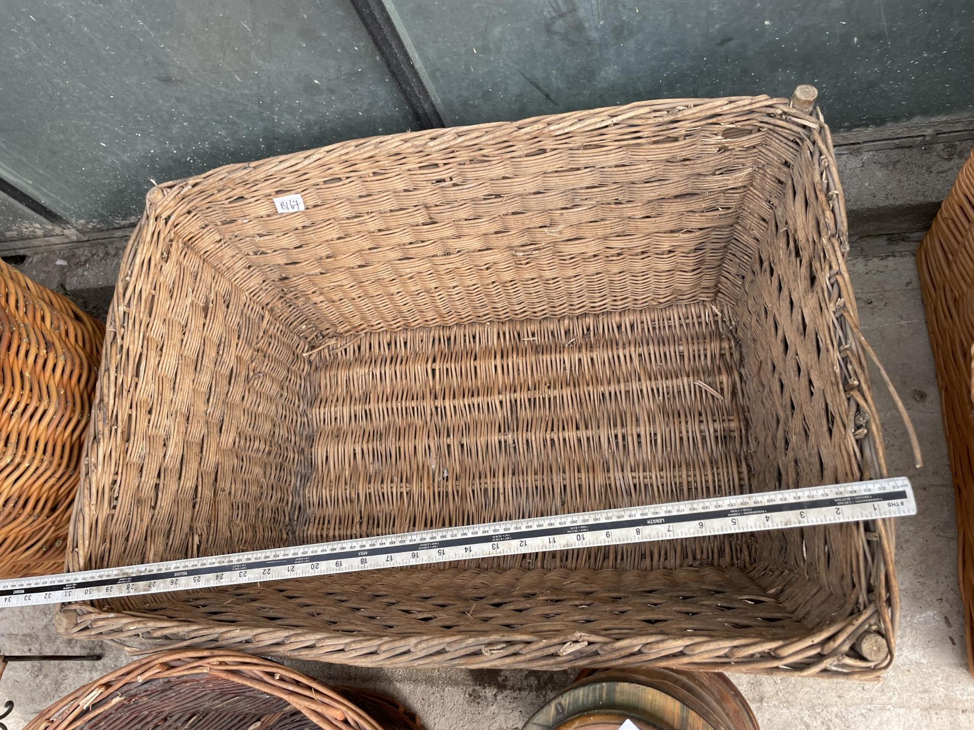 TWO LARGE WICKER LOG BASKETS AND A DECORATIVE WOODEN TABLE LAMP - Image 3 of 5