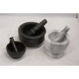 THREE HEAVY PESTLE AND MORTARS TO INCLUDE TWO MARBLE AND A CAST ONE