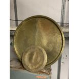 A LARGE HEAVY ISLAMIC BRASS CHARGER, DIAMETER 56CM PLUS A SMALLER PLATE WITH INLAID SILVER AND