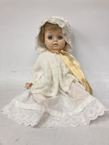 A VINTAGE CHILTERN BABY DOLL WITH CREAM DRESS AND BONNET WITH SLEEPY EYES