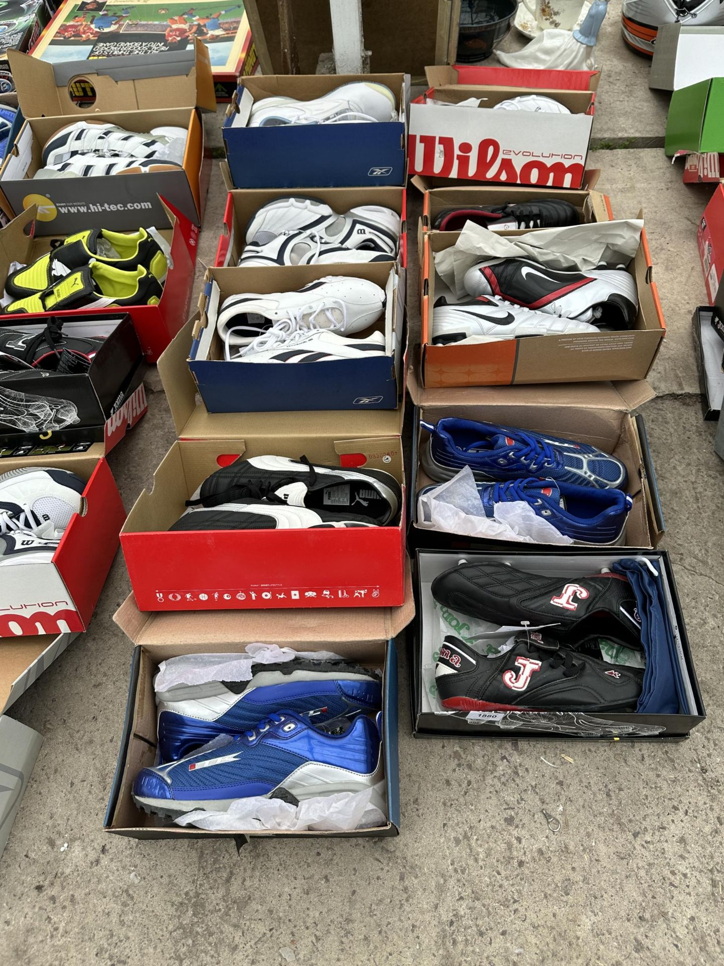 TEN PAIRS OF AS NEW AND BOXED SPORTS BOOTS AND TRAINERS