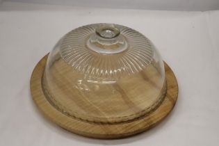 A VINTAGE WOODEN CAKE/CHEESE BOARD WITH GLASS DOME