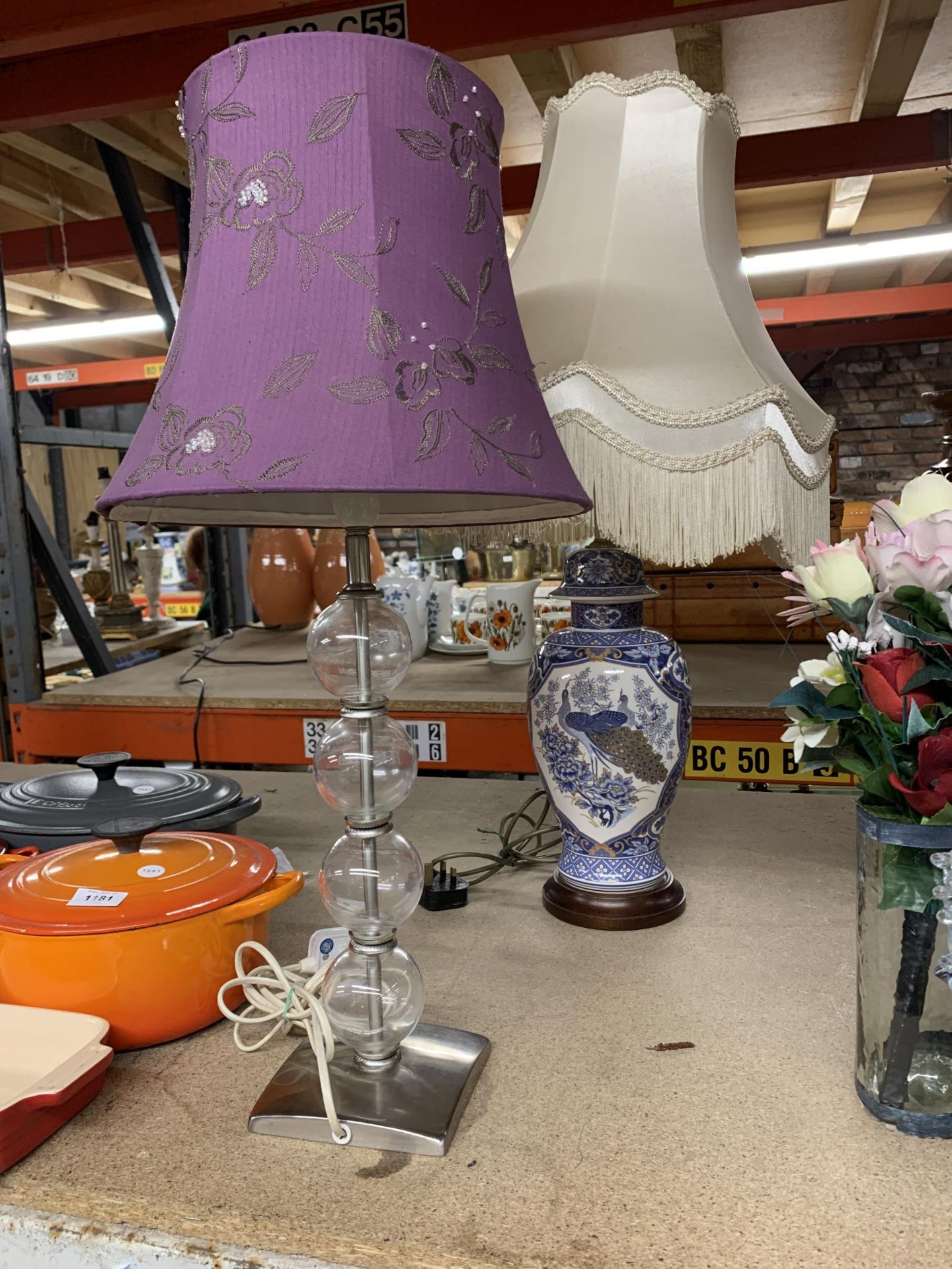 TWO TABLE LAMPS TO INCLUDE A GLASS 'BUBBLE LAMP' WITH CHROME BASE AND AN ORIENTAL STYLE WITH PEACOCK