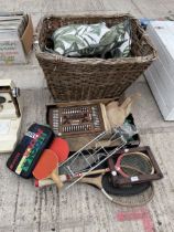 AN ASSORTMENT OF ITEMS TO INCLUDE A LARGE WICKER LOG BASKET, TENNIS RACKETS AND A VINTAGE AUTOBRIDGE