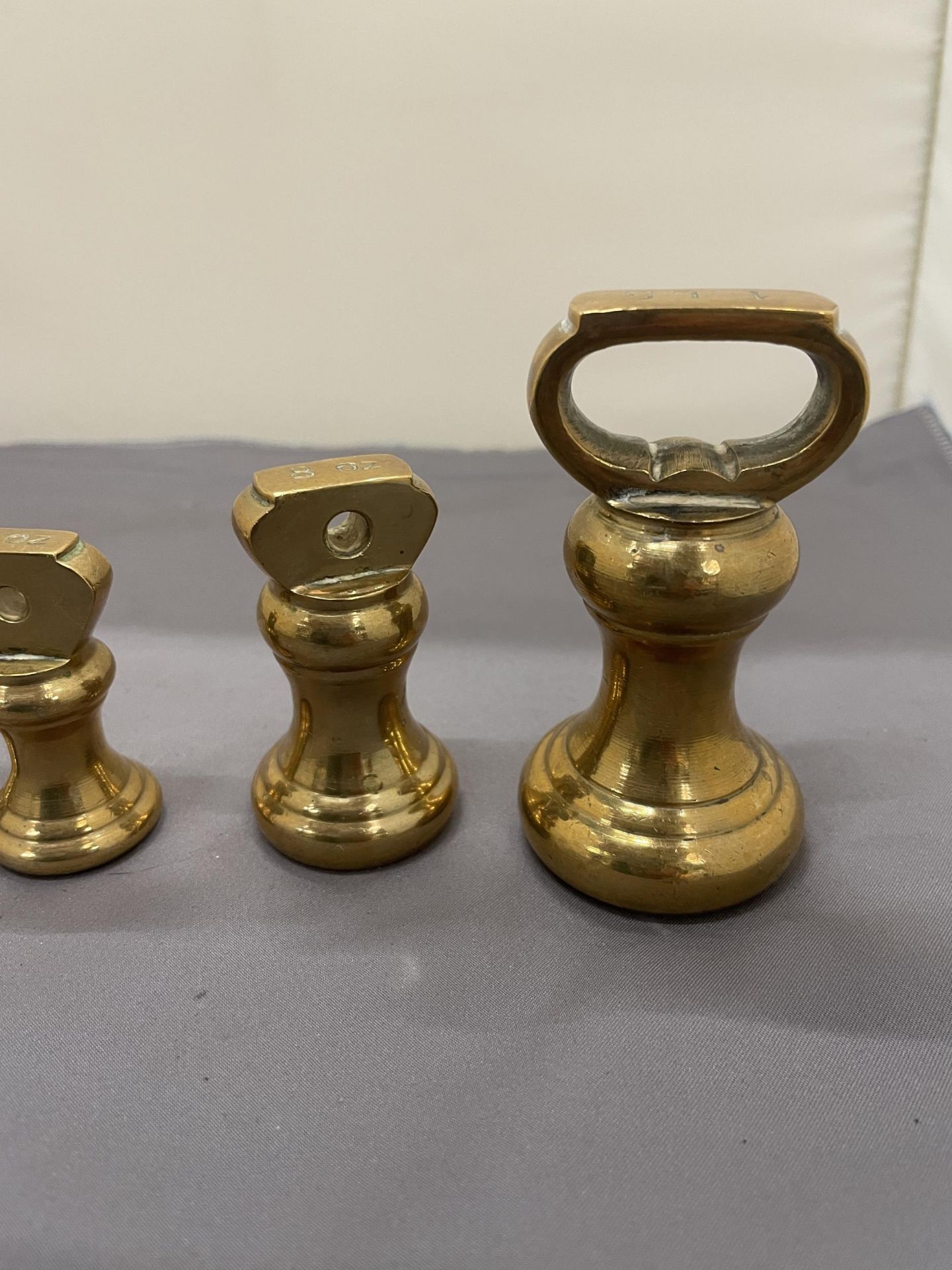 A COLLECTION OF VINTAGE BRASS BELL WEIGHTS - Image 2 of 3