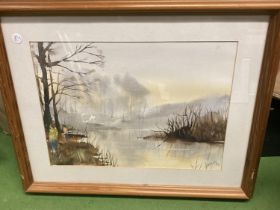 A FRAMED WATERCOLOUR OF A RIVER SCENE SIGNED TO LOWER RIGHT CORNER
