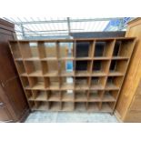 A THIRTY FIVE DIVISION PIGEON HOLE OPEN STORAGE SHELF 83" WIDE, 71" TALL AND 11" DEEP