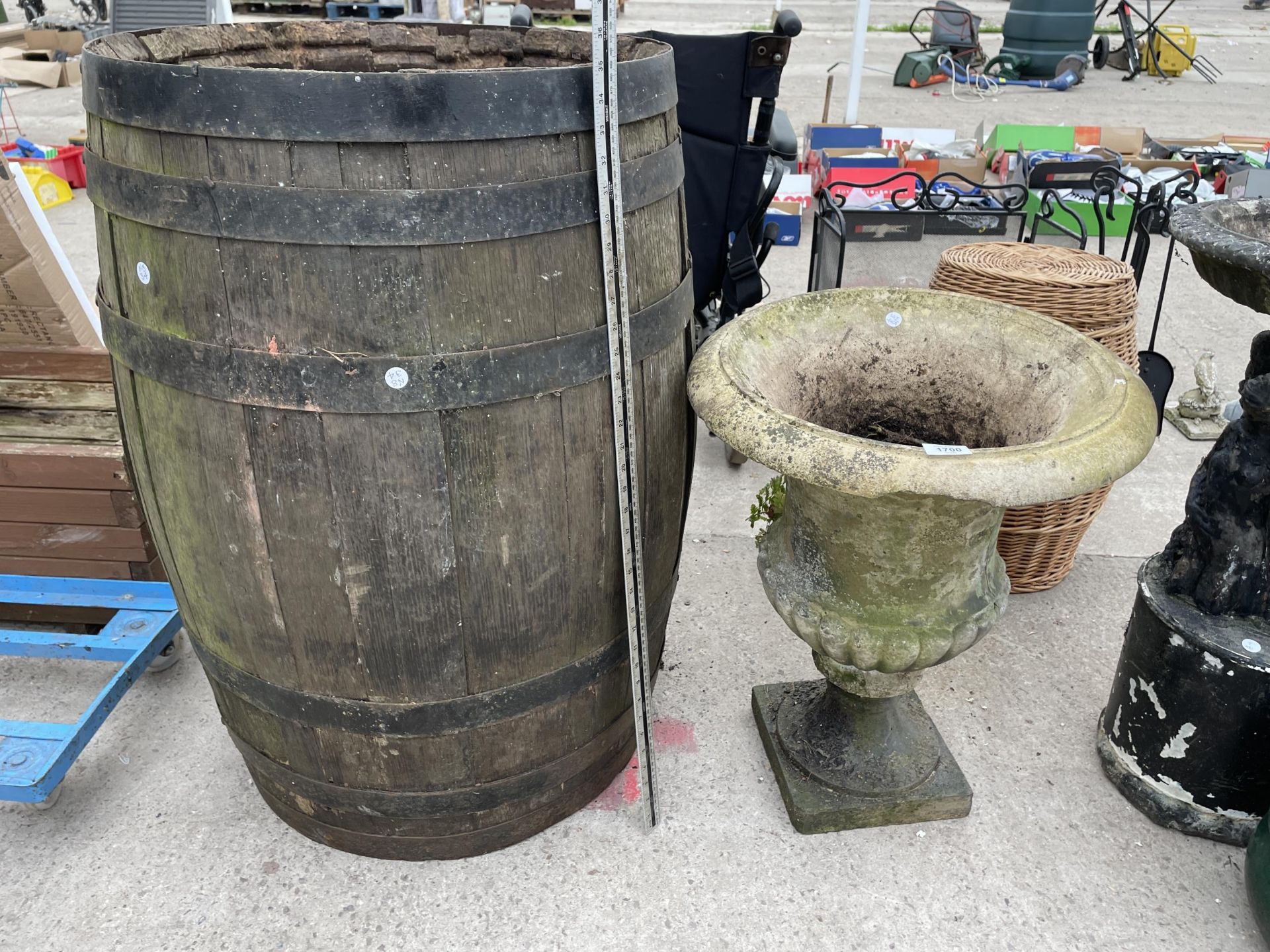 AN OAK BARREL AND A CONCRETE URN PLANTER (A/F)