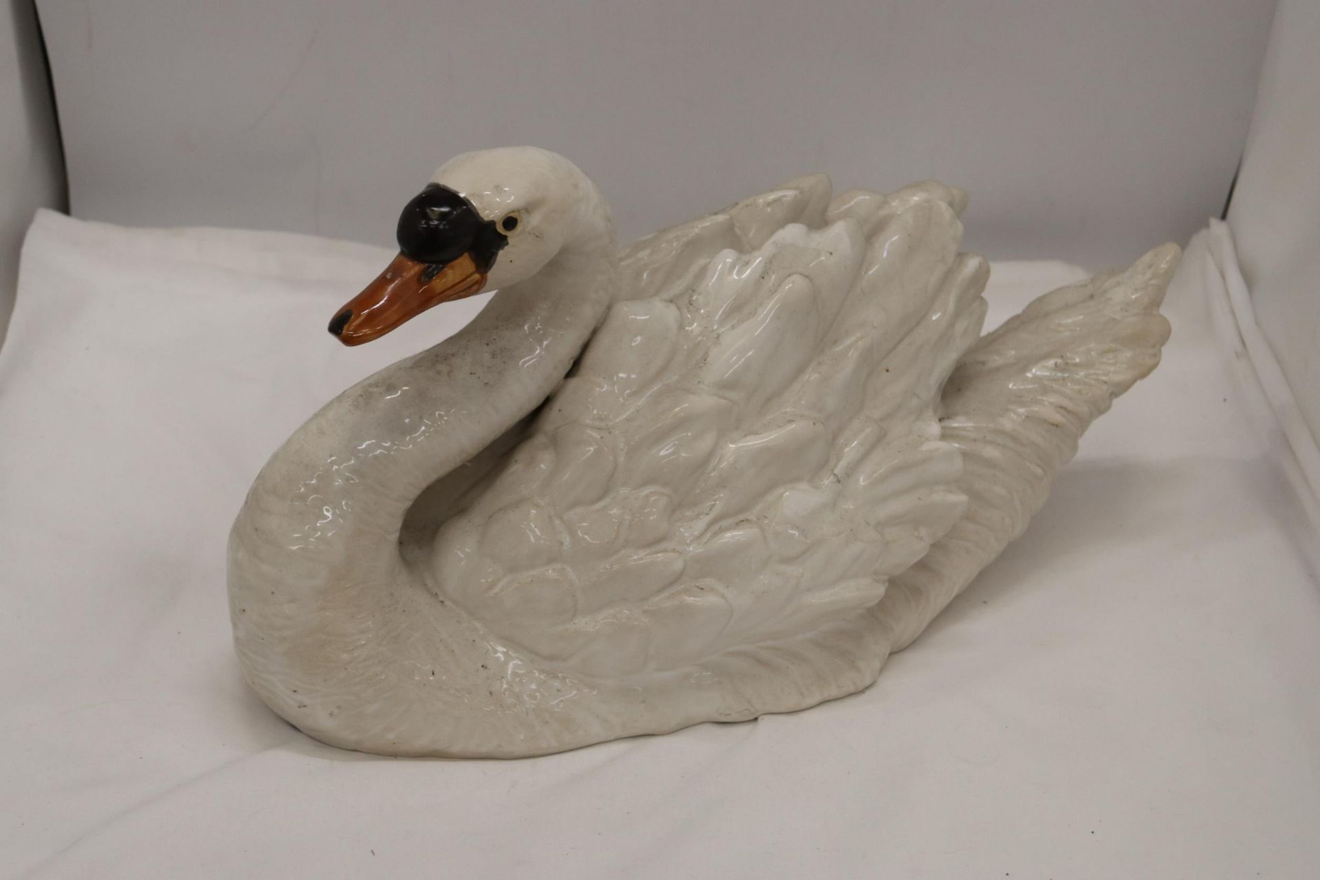 A LARGE CERAMIC SWAN