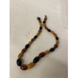 A BELIEVED AMBER OF VARIOUS COLOURS NECKLACE LENGTH 70CM