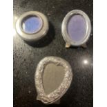 THREE MINIATURE HALLMARKED SILVER PHOTOGRAPH FRAMES TO INCLUDE A DECORATIVE HEART SHAPED EXAMPLE