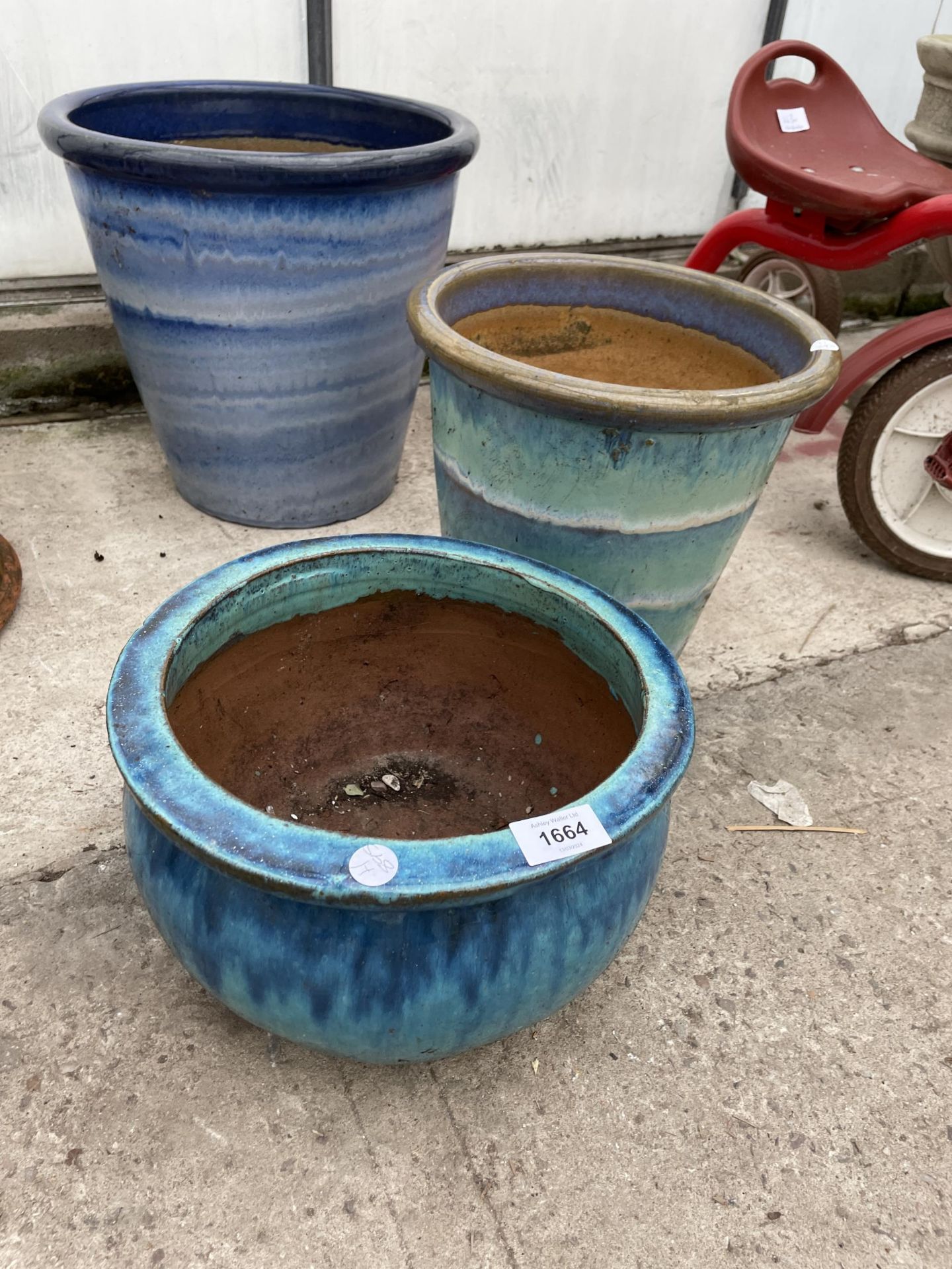 THREE VARIOUS BLUE GLAZED TERRACOTTA PLANT POTS