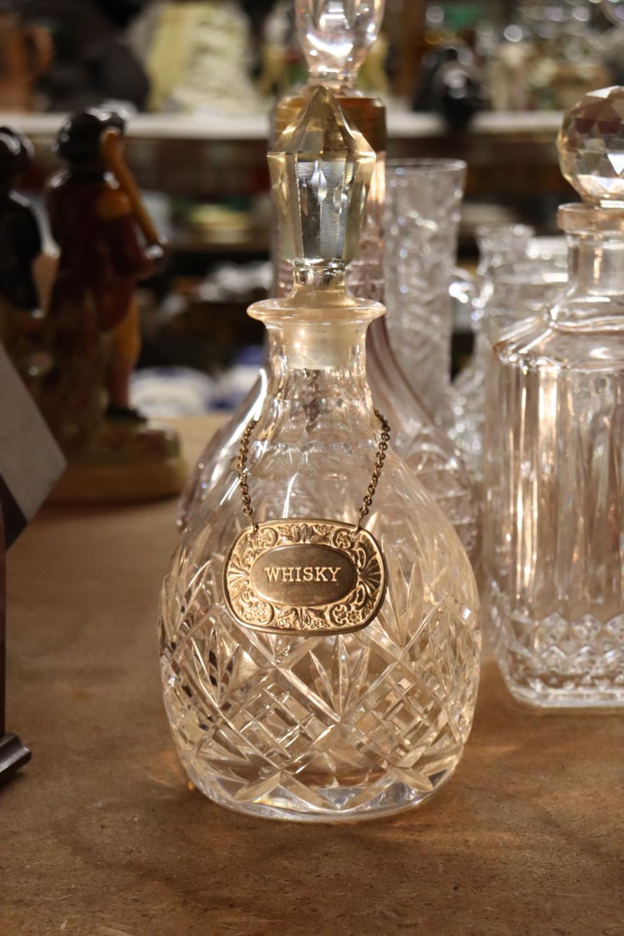 FOUR CUT GLASS DECANTERS ONE WITH A WHISKEY DECANTER LABEL - Image 2 of 4