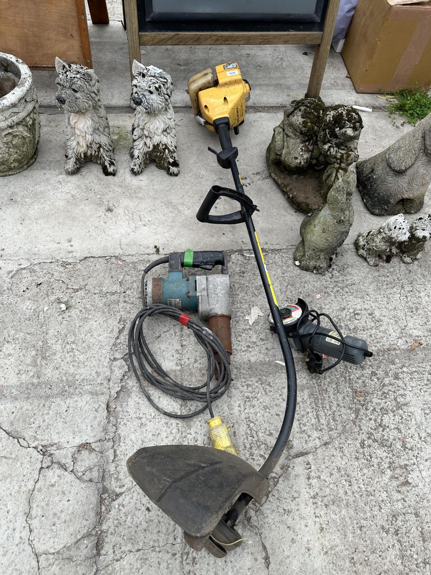 A MCCULLOCH PETROL GRASS STRIMMER, A MAKITA 110V DRILL AND AN ANGLE GRINDER