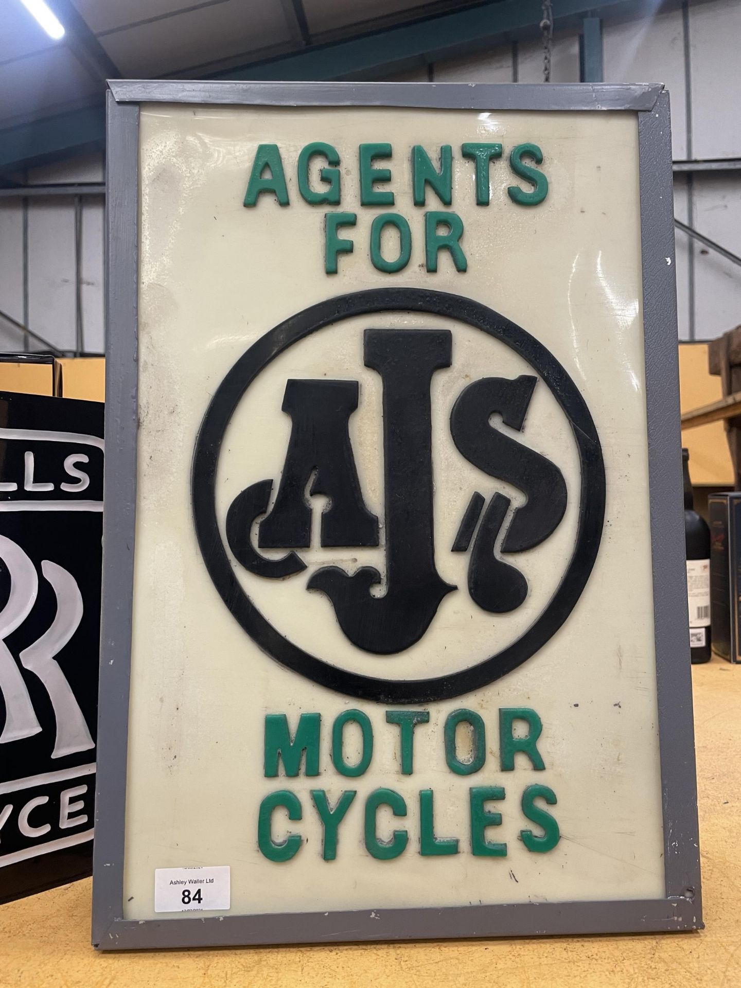 AN ILLUMINATED AGENTS FOR AJS MOTOR CYCLES SIGN