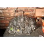 A LARGE QUANTITY OF DRINKING GLASSES