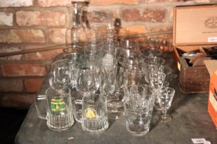 A LARGE QUANTITY OF DRINKING GLASSES