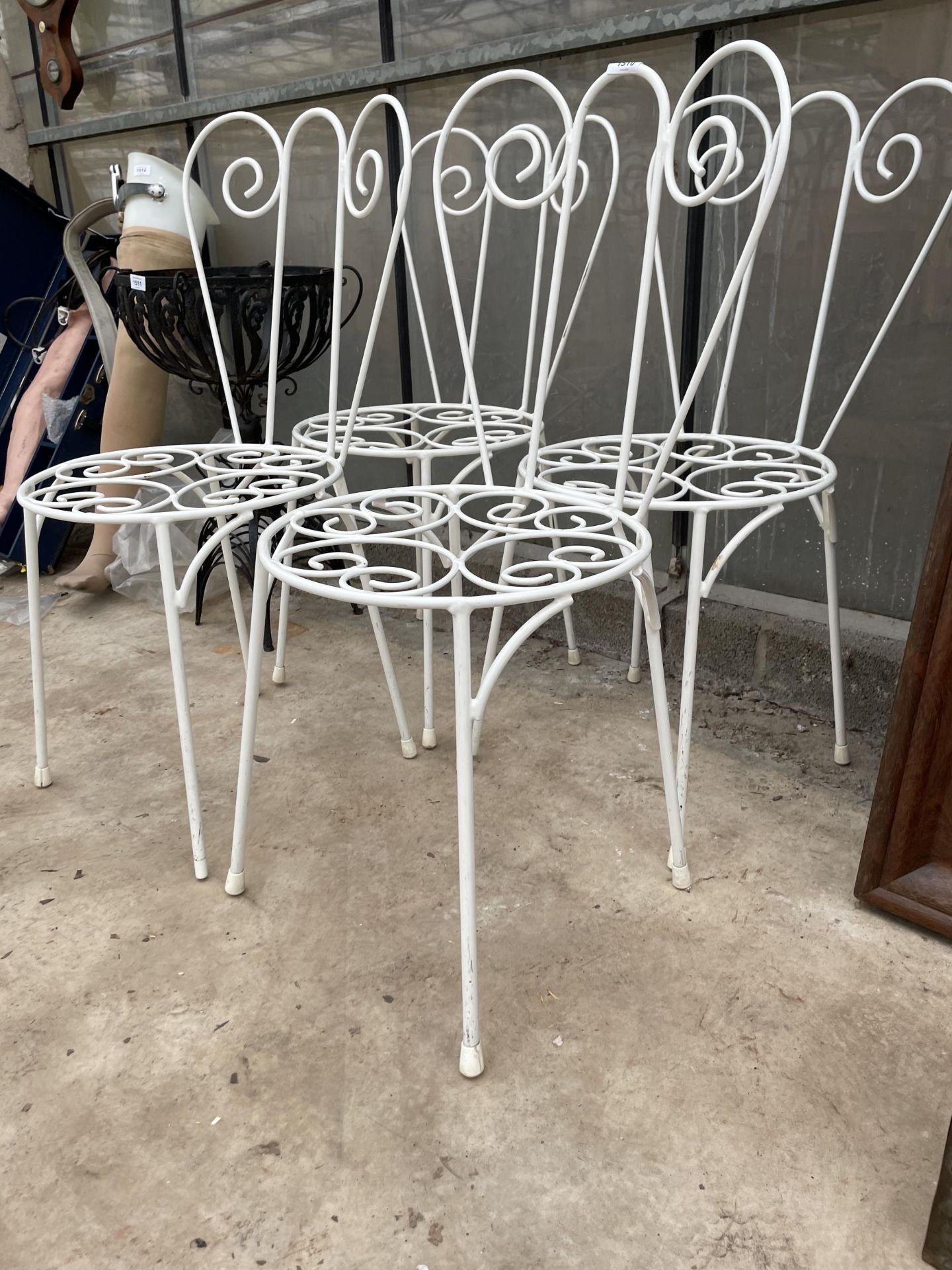 A SET OF FOUR ORNATE AND DECORATIVE WROUGHT IRON BISTRO CHAIRS - Image 2 of 2