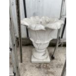 A CONCRETE PETAL URN PLANTER