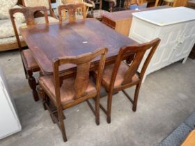 AN EARLY TWENTIETH CENTURY OAK DRAW LEAF DINING TABLE ON PEDESTAL BASE AND FOUR CHAIRS