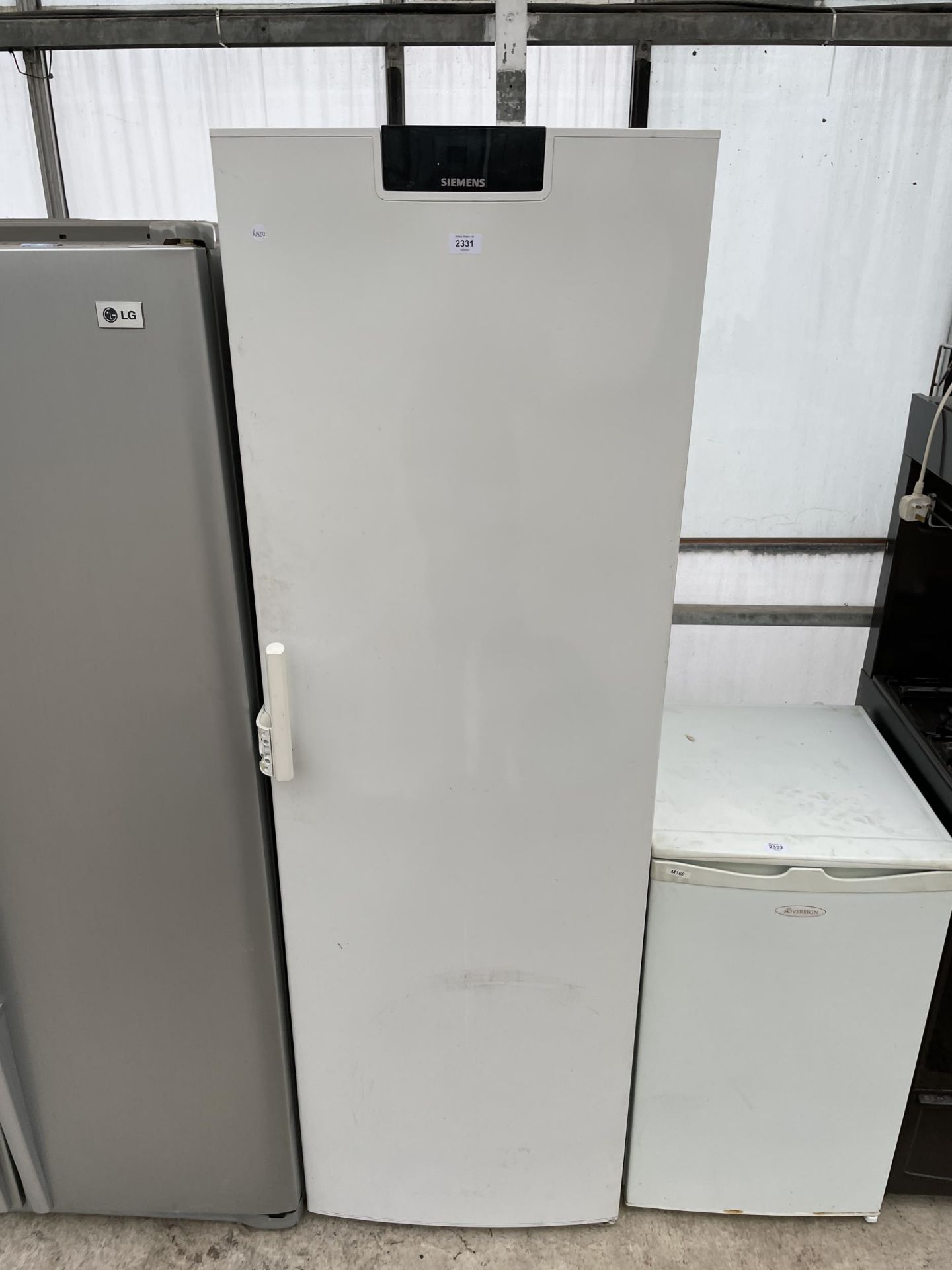 A WHITE SIEMENS UPRIGHT FREEZER