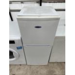 A SMALL WHITE ICEKING UPRIGHT FRIDGE FREEZER