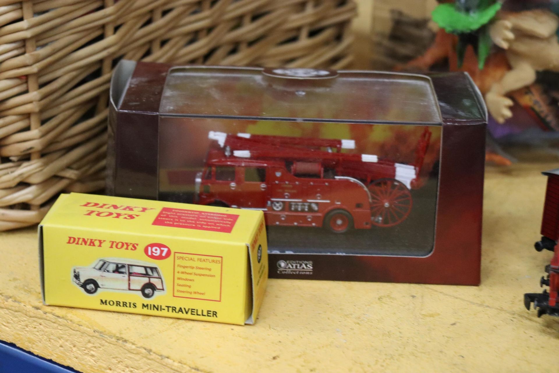 A BOXED DINKY TOYS, NO. 197 MORRIS MINI-TRAVELLER PLUS A BOXED ATLAS FIRE ENGINE