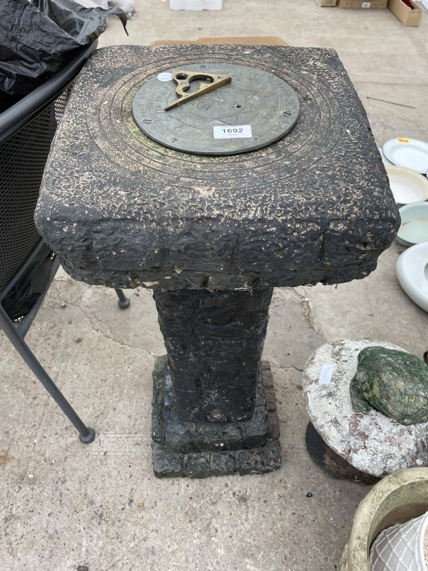 A CONCRETE SUN DIAL WITH BRASS GNOMON (A/F)