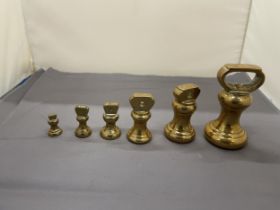 A COLLECTION OF VINTAGE BRASS BELL WEIGHTS
