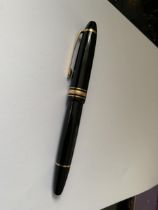 A MONT BLANC MEISTERSTUCK GOLD COATED LE GRAND FOUNTAIN PEN WITH 18 CARAT GOLD MEDIUM NIB
