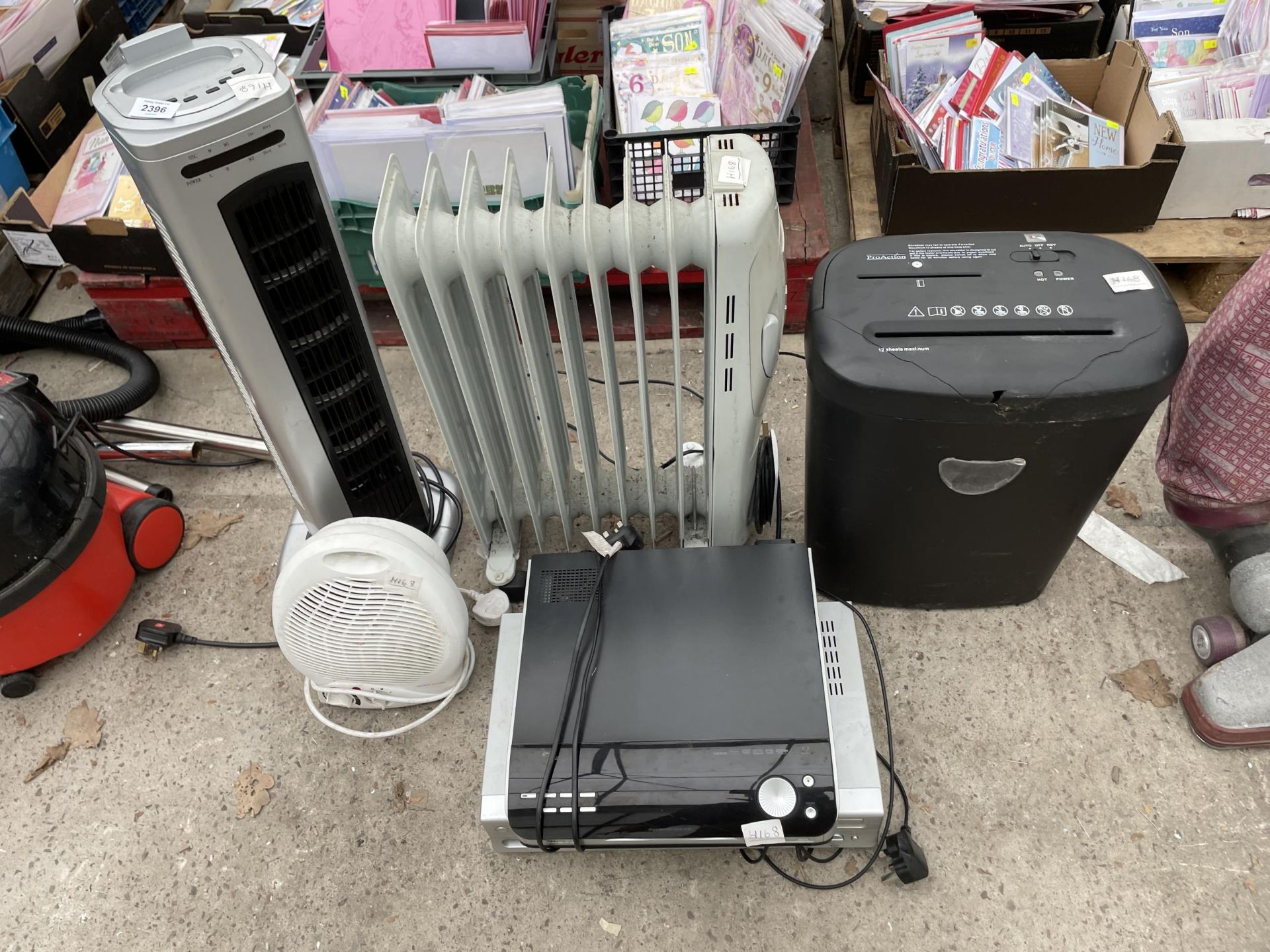 AN ASSORTMENT OF ITEMS TO INCLUDE HEATERS, A DVD PLAYER AND A SHREDDER ETC