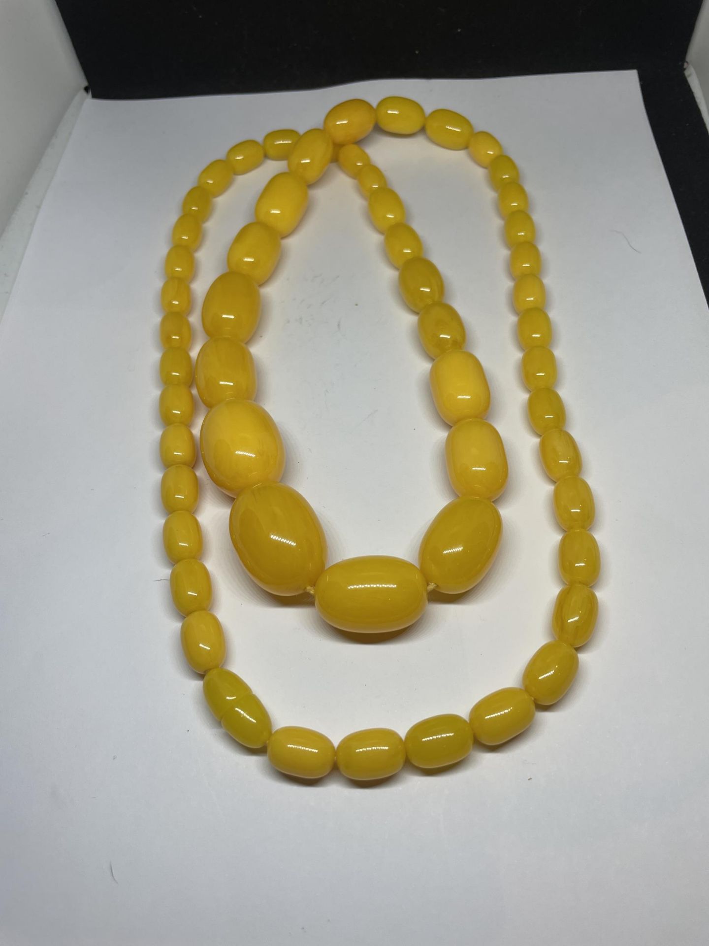 A BELIEVED BUTTERSCOTCH AMBER NECKLACE WITH DISCREET SCREW CLASP LENGTH 95CM