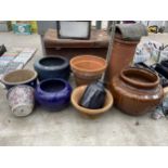 A LARGE ASSORTMENT OF GLAZED AND TERRACOTTA PLANT POTS