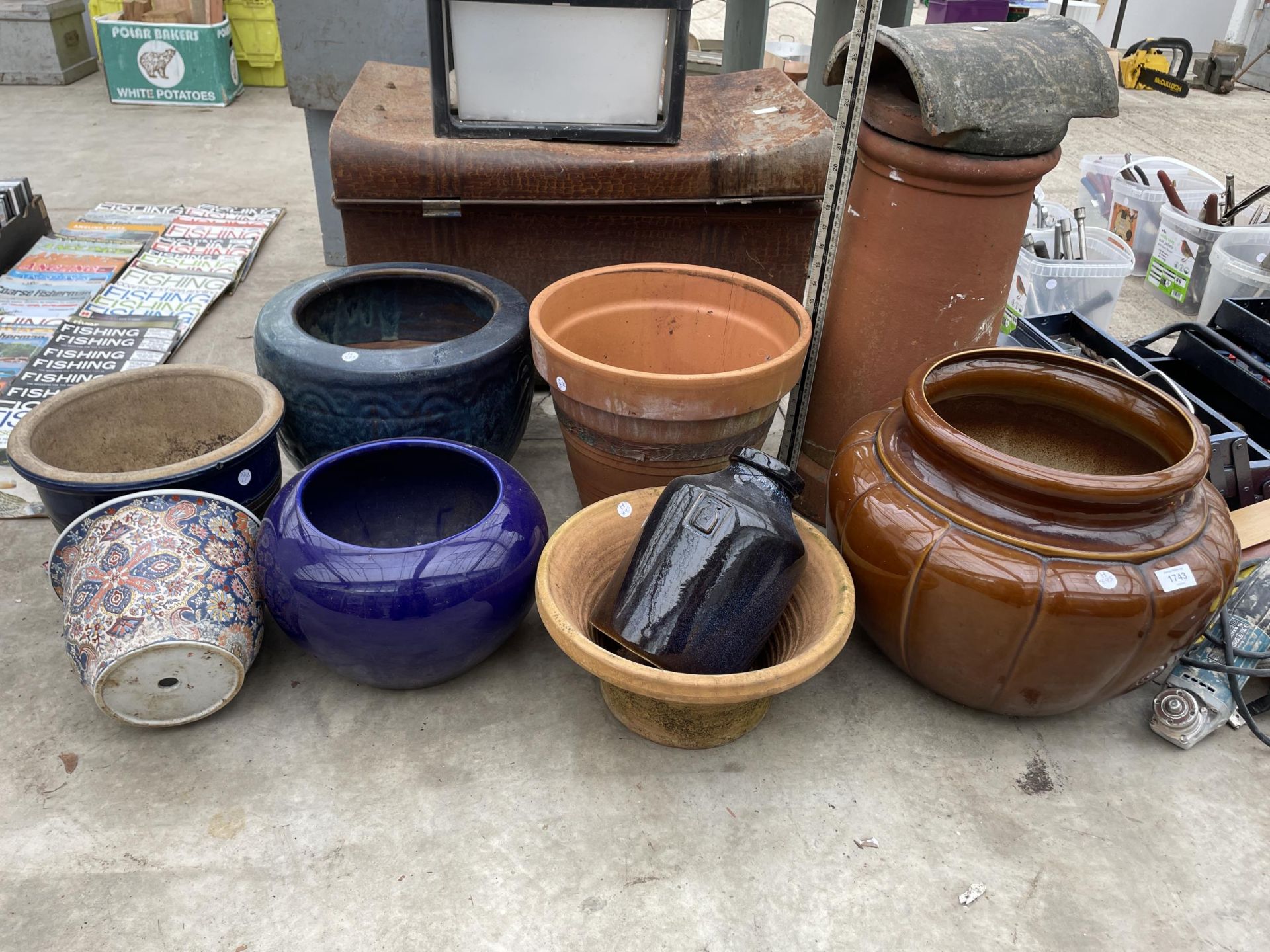 A LARGE ASSORTMENT OF GLAZED AND TERRACOTTA PLANT POTS