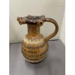 A ROYAL DOULTON LAMBETH PUZZLE JUG WITH A FOUR LINE VERSE