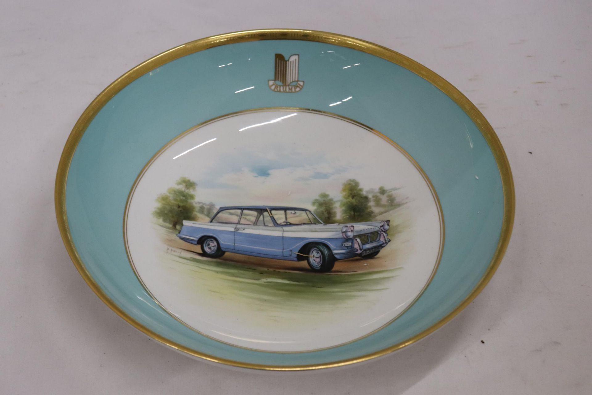 A MINTON HAND PAINTED TRIUMPH HERALD BOWL