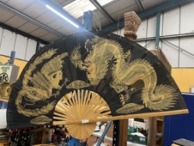 A LARGE VINTAGE ORIENTAL SILK FAN ON BAMBOO