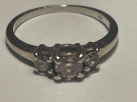 A 9 CARAT GOLD RING WITH PINK TOPAZ AND CUBIC ZIRCONIA STONES SIZE H/1