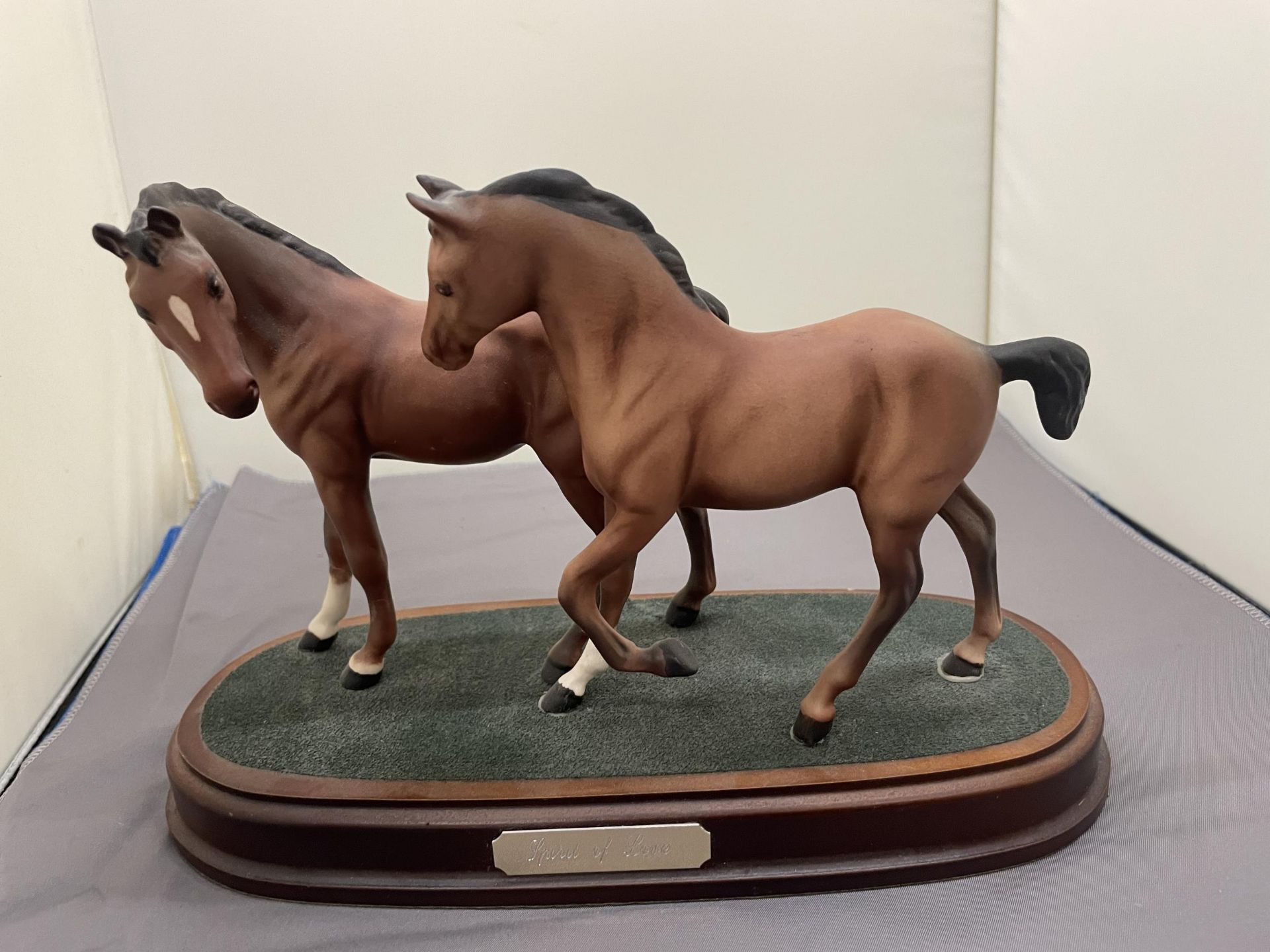 A HORSE AND FOAL FIGURE ON A PLINTH, ENTITLED 'SPIRIT OF LOVE'
