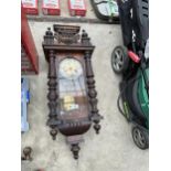 A VINTAGE WOODEN CASED WALL CLOCK